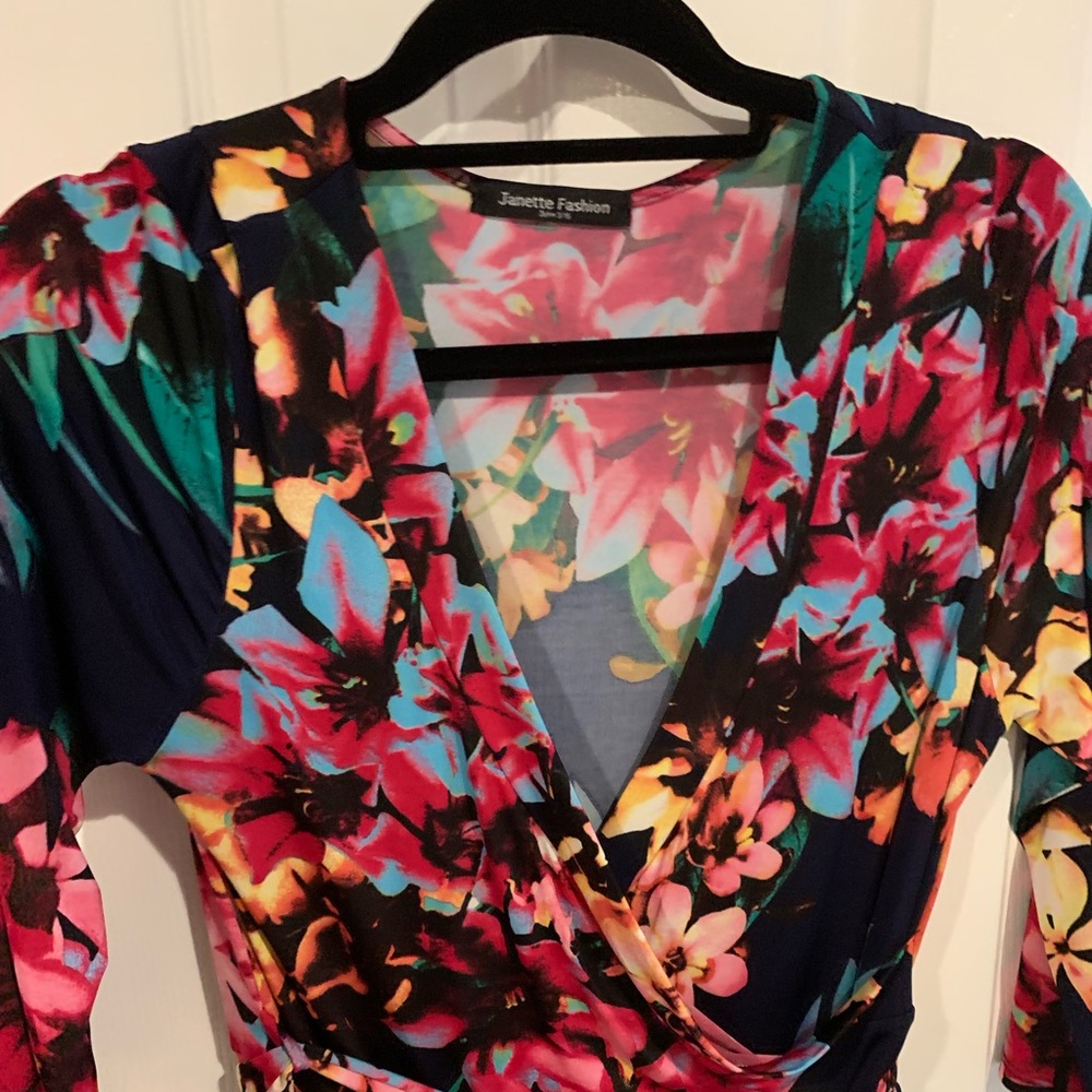 Vibrant, colorful floral maxi with a faux wrap top